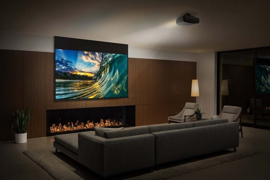 A luxury media room with a Sony projector.