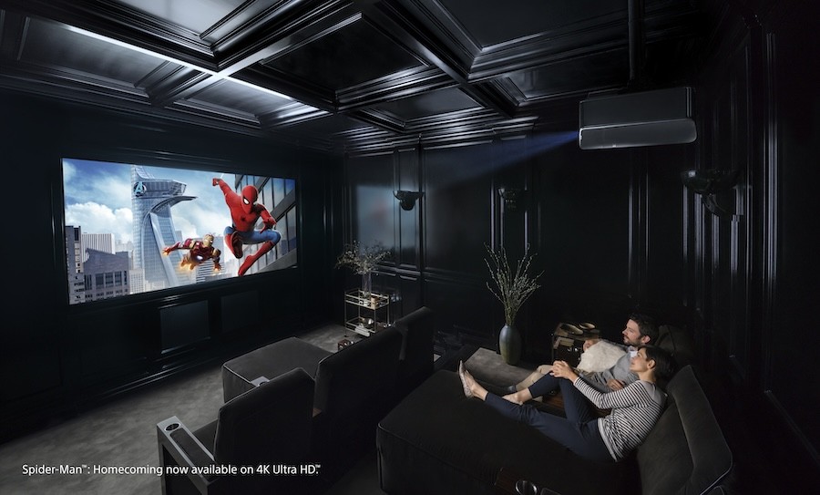 A couple enjoying a movie in their home theater.