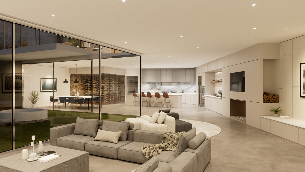 Modern open-concept living space with a cozy gray sectional sofa, minimalist kitchen, and wine wall.